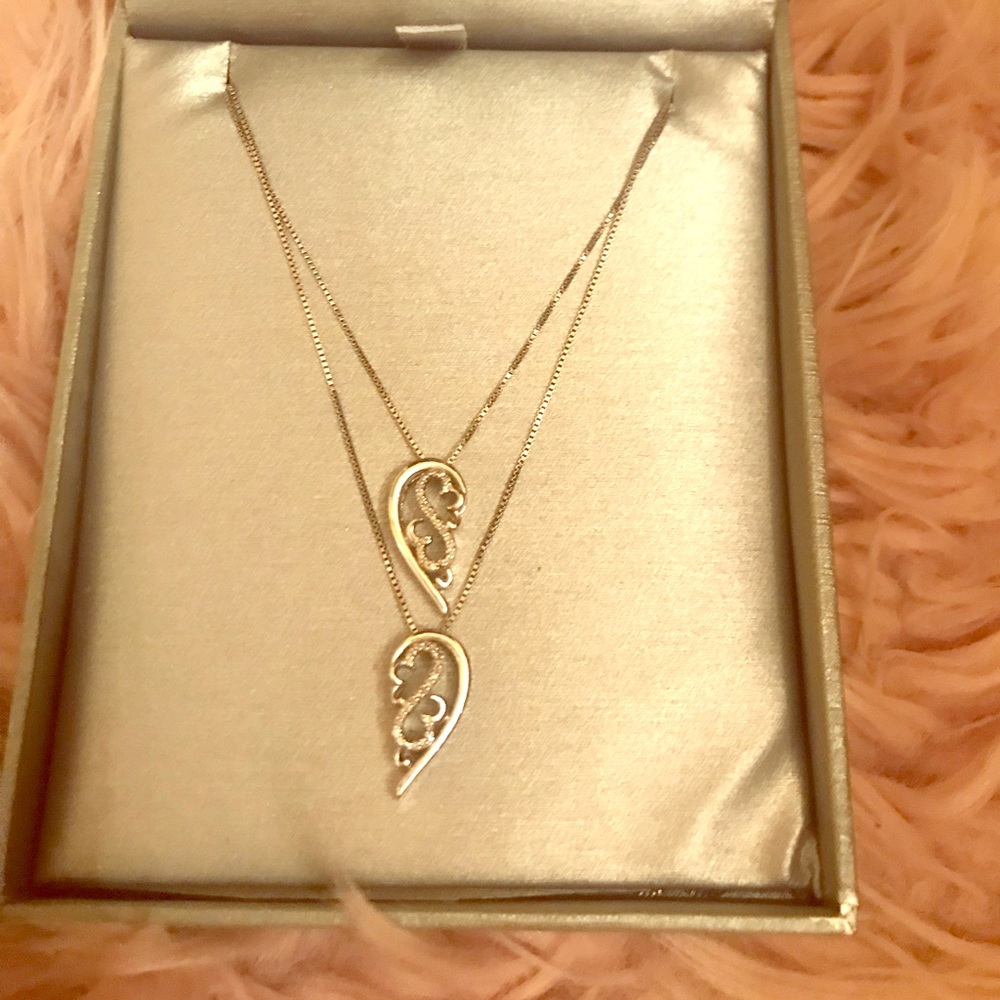 2 Zales Diamond necklaces. Open Heart Collection